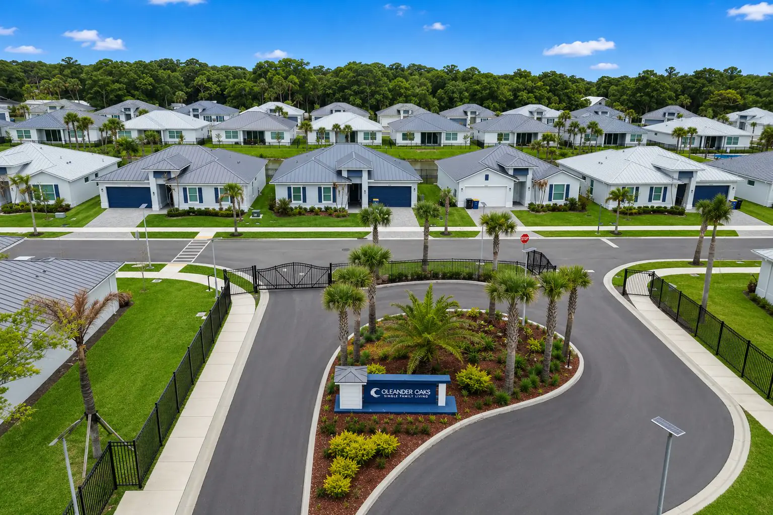 Aerial view of the Oleander Oaks gated entrance and homes